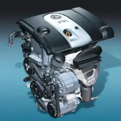 Silnik Volkswagen 1.6 MPI z widocznymi paskami, alternatorem i osłoną.