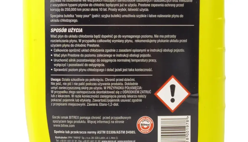 Jasnożółta butelka płynu do chłodnic Prestone z instrukcją użycia i ostrzeżeniami.