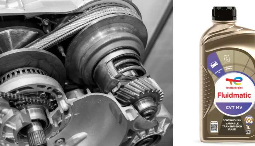 Wnętrze skrzyni biegów CVT i butelka płynu Total Fluidmatic.
