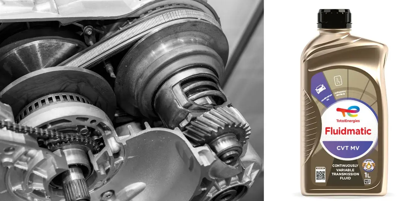 Wnętrze skrzyni biegów CVT i butelka płynu Total Fluidmatic.